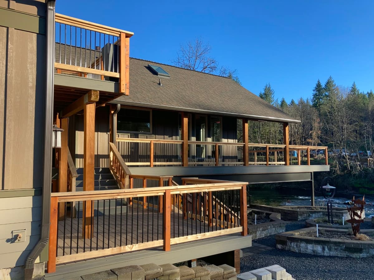 Elevated cedar and cable-rail deck overlooking a river